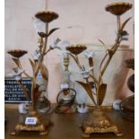 A pair of modern gilt metal candelabra in the Aesthetic Movement style with ceramic bosses and