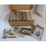 A box containing over five hundred old postcards