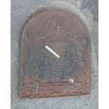 A cast iron fire back with moulded coat of arms to front and Kingsworthy Foundry mark to rear