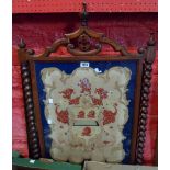 A 19th Century oak firescreen panel with heraldic tapestry panel under glass - sold with a framed
