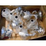 A box containing five decorative glass and chrome two branch wall candelabra, each with lustre