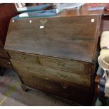 A 1.07m antique mahogany bureau with fitted interior over two short and three long graduated