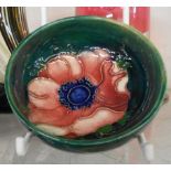 A small Moorcroft pottery dish decorated in the Anemone pattern - small chip to rim