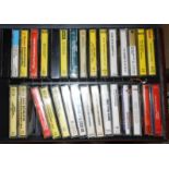 A case containing a quantity of music cassettes - various artists