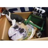 A box containing a novelty Friesian cow pattern loo roll holder, Leonardo resin collie figurines and