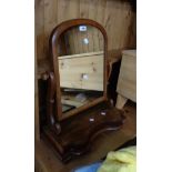 A Victorian mahogany framed platform dressing table mirror with arched plate and serpentine base