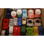 A box containing a quantity of ceramic novelty car items including egg cups, cruets, etc.