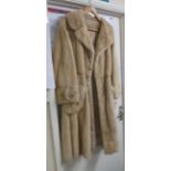 A vintage long fur coat with crown motif lining