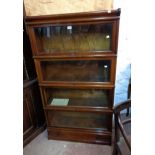 An 86cm vintage Globe Wenicke mahogany four section modular elastic bookcase with cornice and drawer