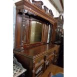A 1.5m late Victorian walnut mirror back sideboard with flanking mouded supports over three frieze
