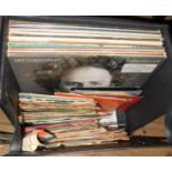 A record case containing a quantity of LP and 45 records including David Bowie, Art Garfunkel, etc.
