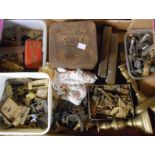A box containing a large quantity of metal items including door fittings, hooks, candlesticks, etc.