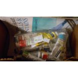 A small box containing a quantity of part used oil paints and painting books