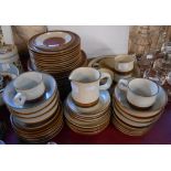 A quantity of Denby stoneware Potters Wheel pattern tableware including various plates, bowls,