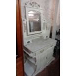 A 1.07m late Victorian white painted marble topped washstand with swing mirror, flanking shelves and