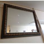 A decorative green painted and parcel gilt framed oblong wall mirror with oak leaf and acorn