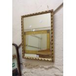 A decorative gilt framed oblong wall mirror