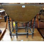 A small oak gateleg table with barley twist supports - in need of re-polishing