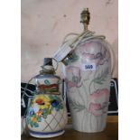 A pottery table lamp with hand painted and stenciled poppies decoration - sold with a smaller