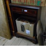 A reproduction mahogany bedside unit with drawer and open shelves