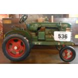 A modern painted tin model tractor