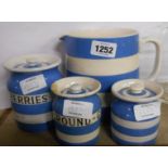 Four pieces of TG Green Cornishware comprising large milk jug, cherries storage jar, small ground