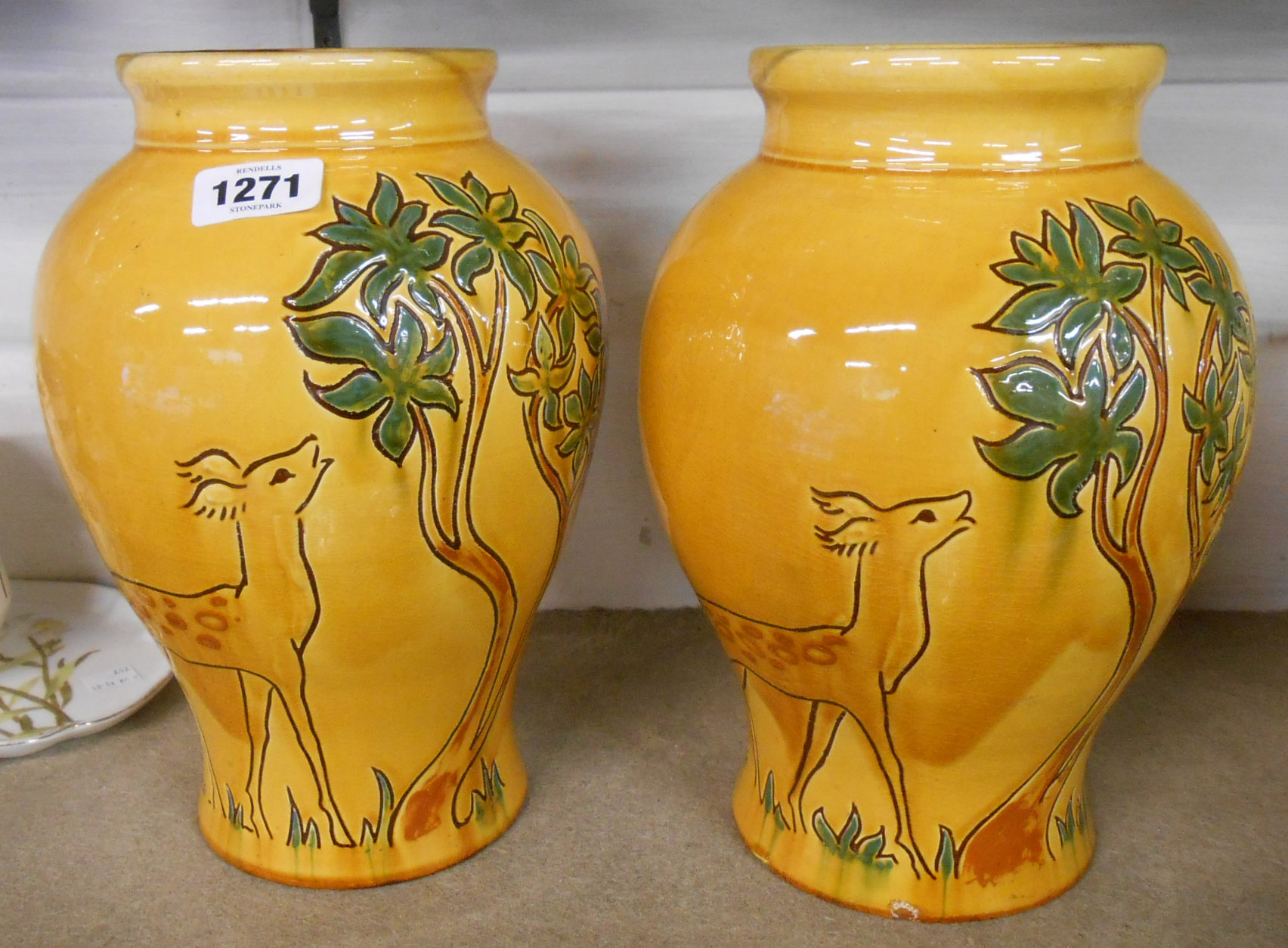 A pair of 1930's C.H. Brannam Barnstaple pottery vases with sgrafitto decoration in the Art Deco