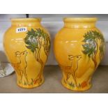 A pair of 1930's C.H. Brannam Barnstaple pottery vases with sgrafitto decoration in the Art Deco