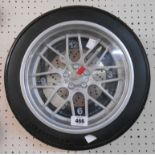 A wall timepiece in the form of an alloy wheel with tyre border - battery movement