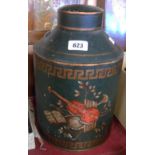 A vintage Toleware painted tin tea cannister, each side depicting assorted musical instruments