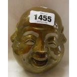 A large modern cast brass four sided head