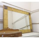 A gilt framed antique style bevelled oblong wall mirror with applied decoration to corners - 1.2m