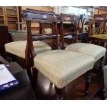 Three matching late Regency mahogany framed dining chairs with modern upholstery to seats, set on