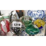 Six decorative glass paperweights including flower and bubble and fruit and swirl examples