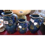 A set of three Lannock pottery graduated stoneware jugs