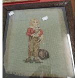 A framed antique woolwork and embroidery portrait, depicting a child holding a dog