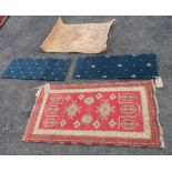 A small handmade Indian kazak rug - sold with a small modern Belgian mat and 2 others