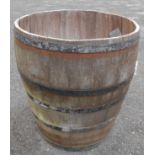 A large French coopered barrel, cut down for use as a very large planter