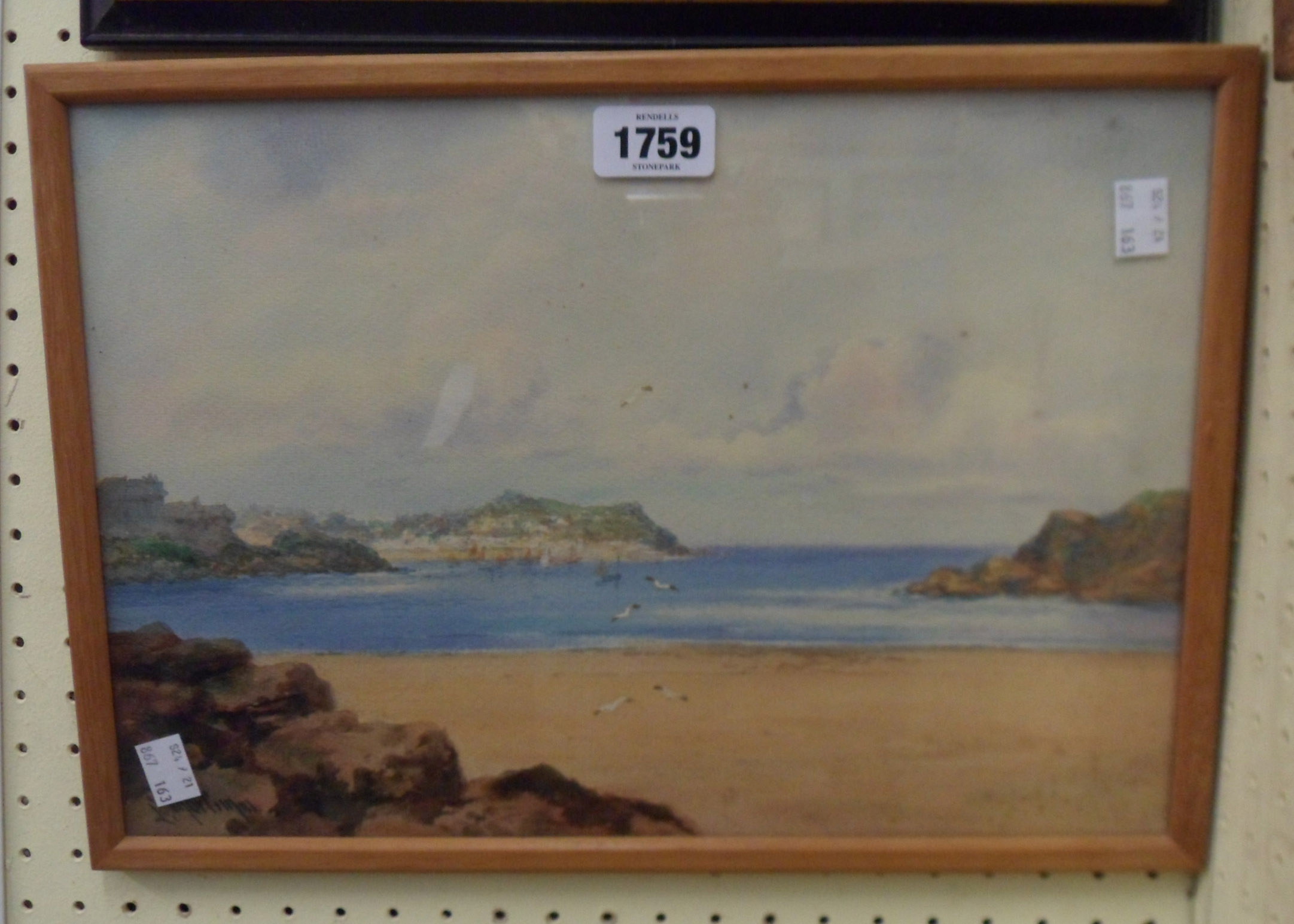 Louis Mortimer: a framed watercolour, depicting a Westcountry coastal scene with town beyond - 24.