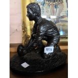 A limited edition bronzed resin figurine of a rugby player - signed J. Rynhart E/300 - WITHDRAWN