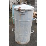 A large lidded galvanised feed bin