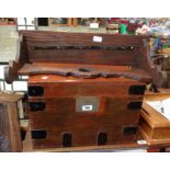 An old iron bound tuck box with varnished finish and flanking iron drop handles - later internal