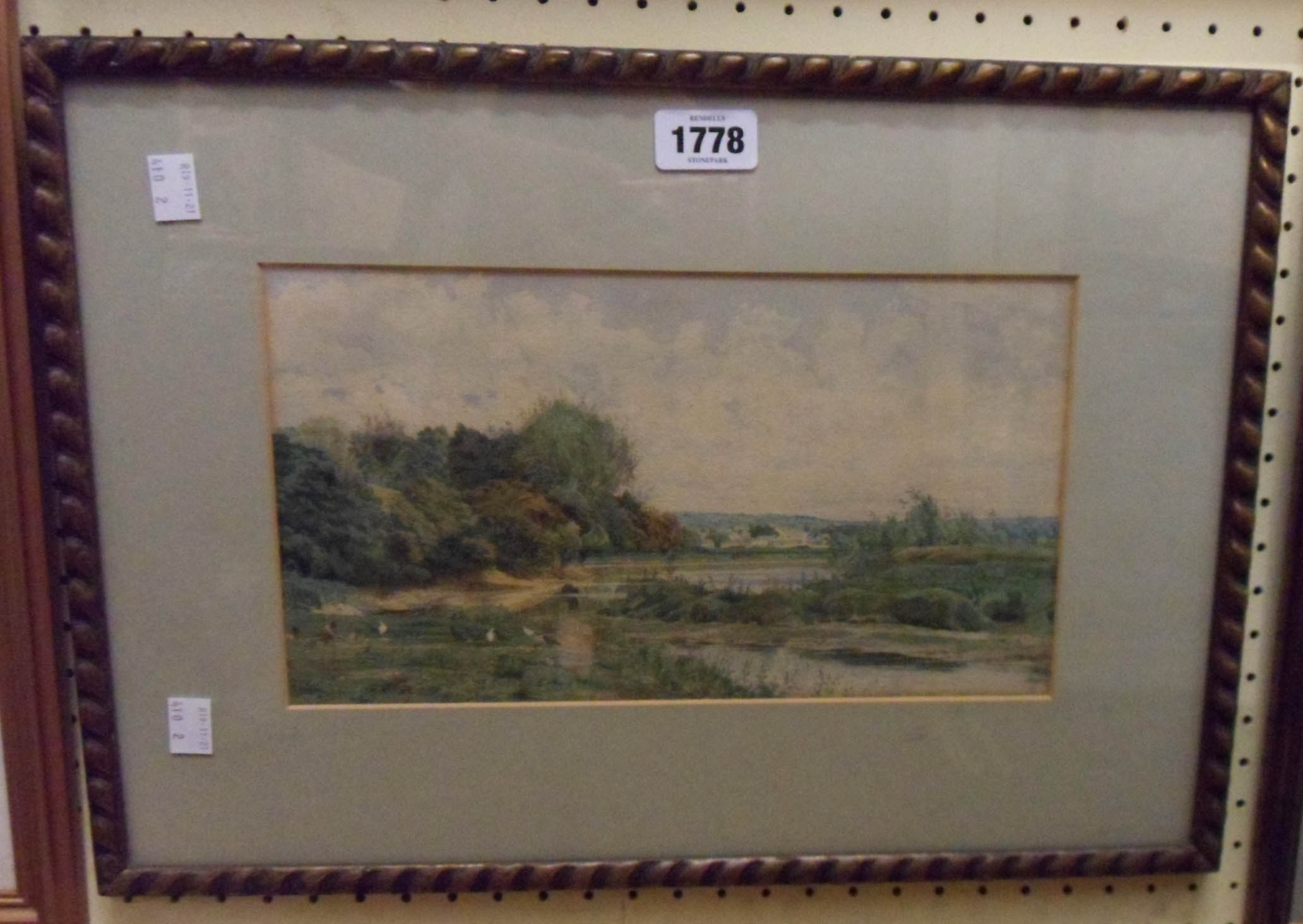 A. Shelley: a gilt framed watercolour, depicting a river landscape - signed and dated 1879
