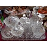 A 1930's cut glass dressing table set comprising trinket boxes, ring holder, scent bottles and