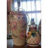 A pottery table lamp with hand painted and stenciled poppies decoration - sold with a smaller