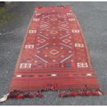 A large handmade Afghan Kelim runner with central geometric pattern and repeat border - 326cm X