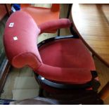 A late Victorian ebonised wood framed boudoir bow elbow chair with old rose velour upholstered