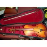 A modern miniature violin in case