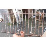 A vintage wrought iron railing section with remains of original paint