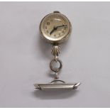 A vintage white metal (marked) bull's-eye glass nurse's fob watch with visible lever works -